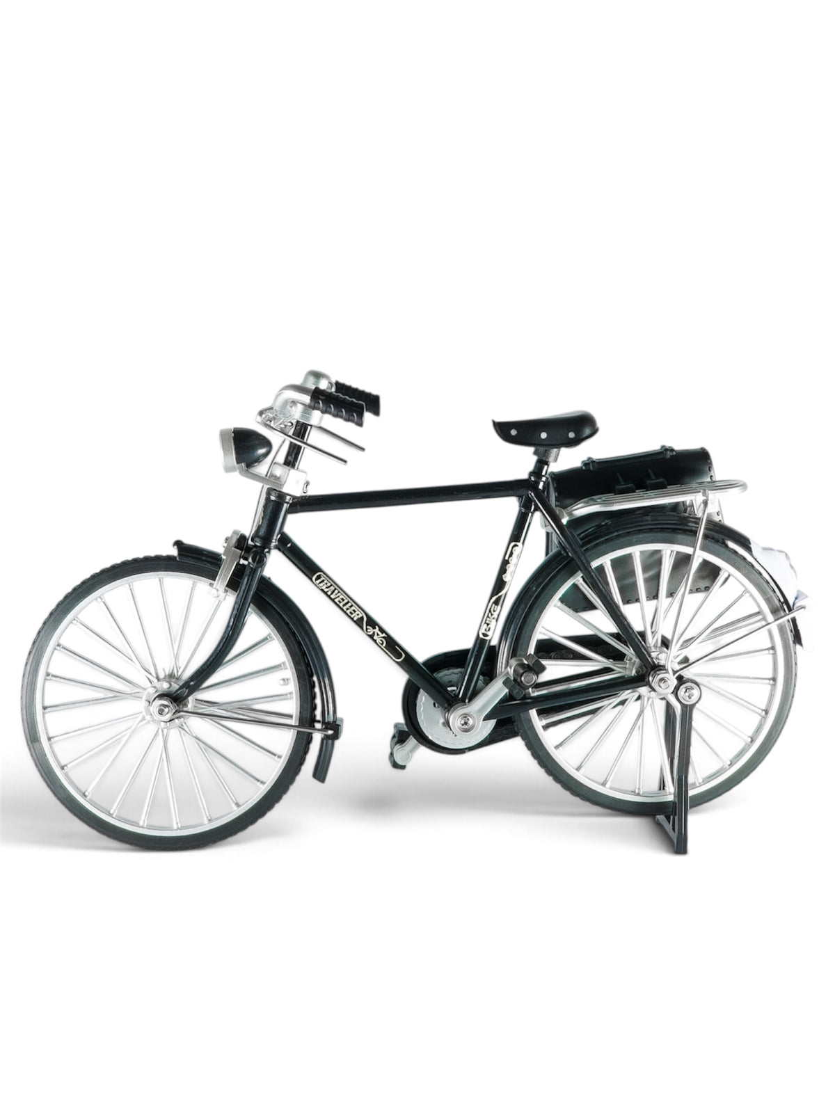 Descriptive: Front-three-quarter view of a miniature black classic city bike with silver mechanical details, black seat, and a dark pannier bag attached to the rear rack.