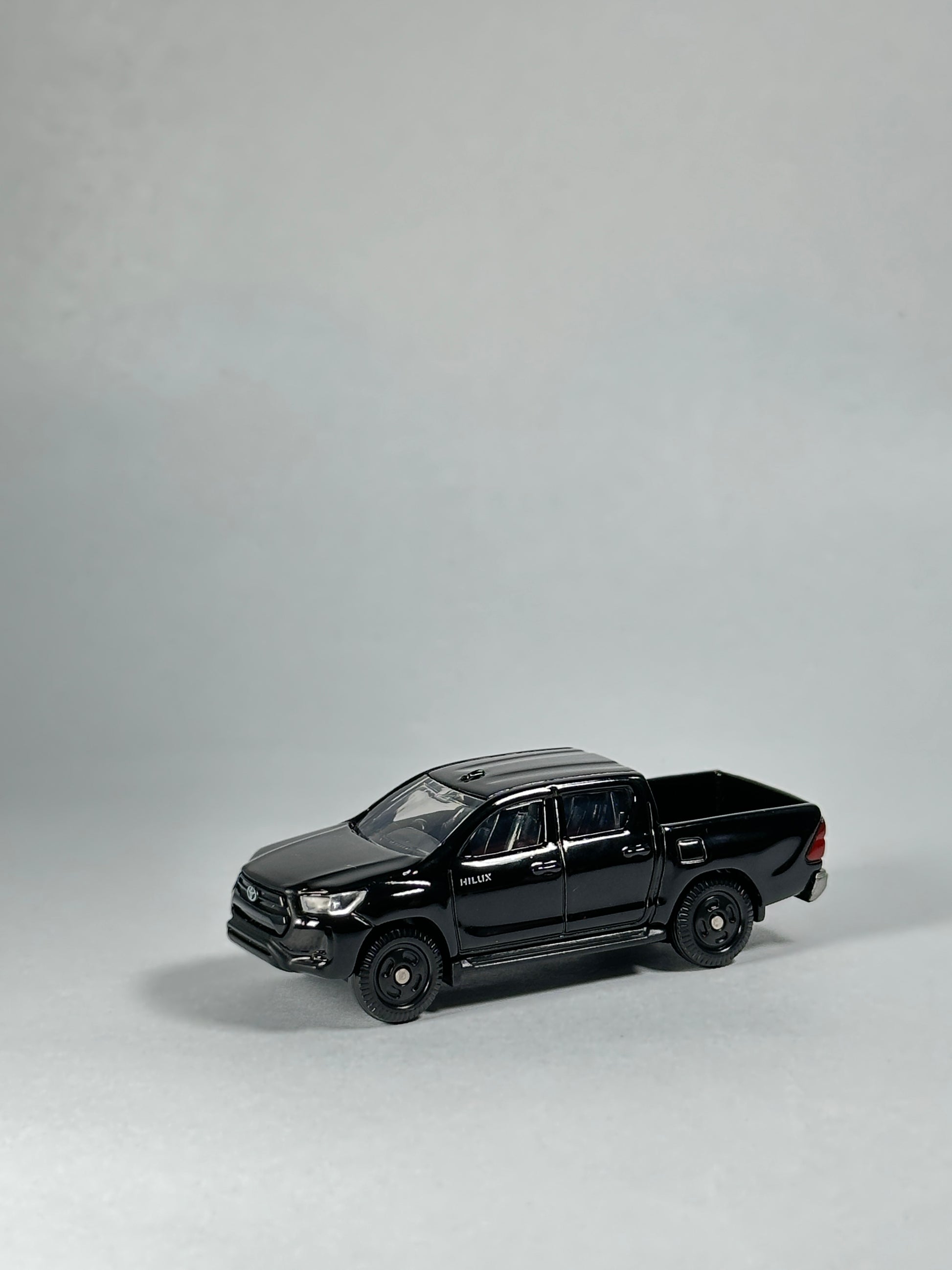 Takara Tomy Toyota Hilux 67 1/70 scale diecast truck in gloss black