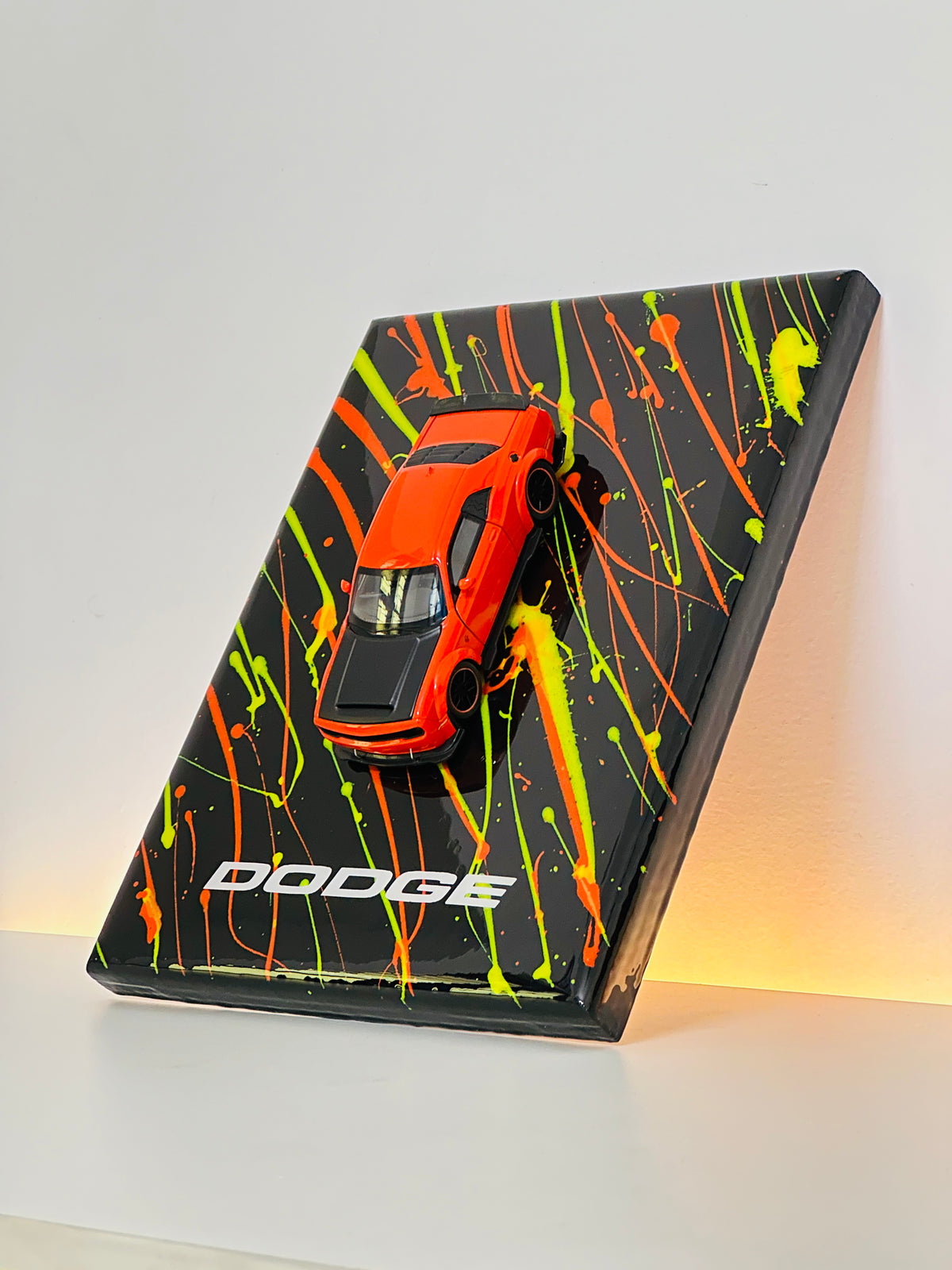 Premium Dodge resin diecast collectible with neon green and orange paint splatter