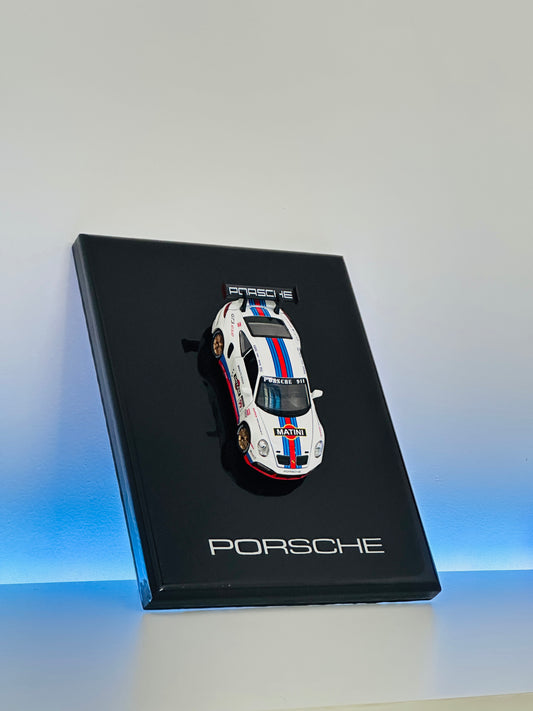 Premium Porsche 911 Martini Racing resin diecast model car displayed on a black collector display frame.