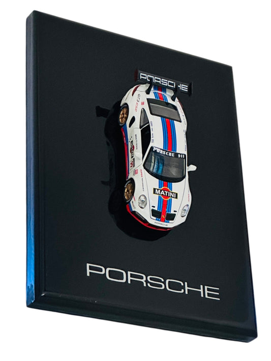 Premium Porsche 911 Martini Racing resin diecast model car displayed on a black collector display frame.