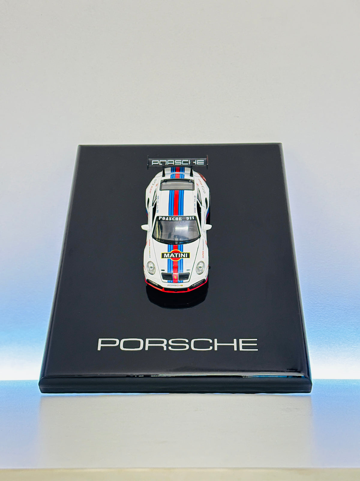 Detailed Porsche 911 miniature race car display frame