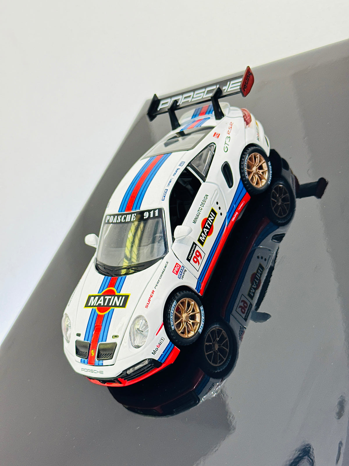 Porsche Martini Racing diecast model car in premium black frame