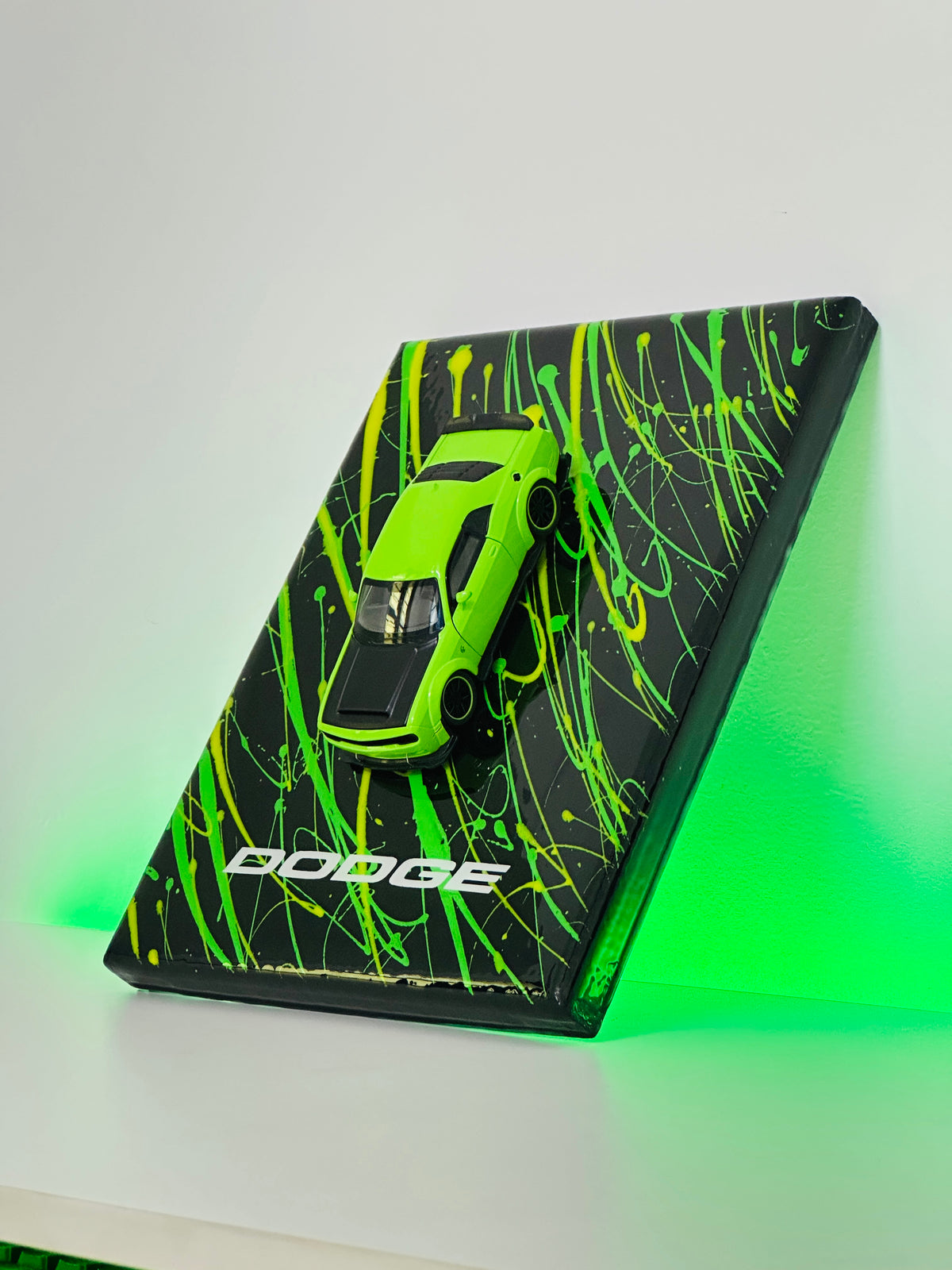 Green Dodge diecast model car in premium resin display frame