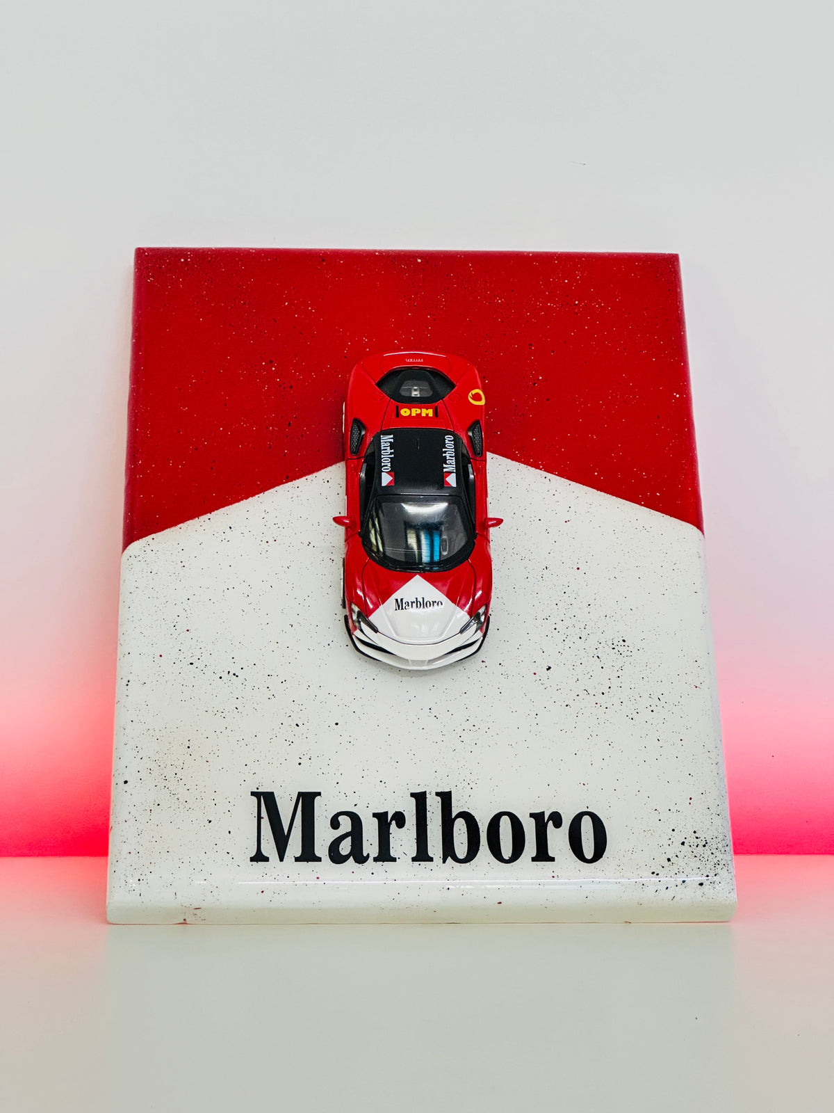 1:32 scale red racing car mounted on premium resin display panel